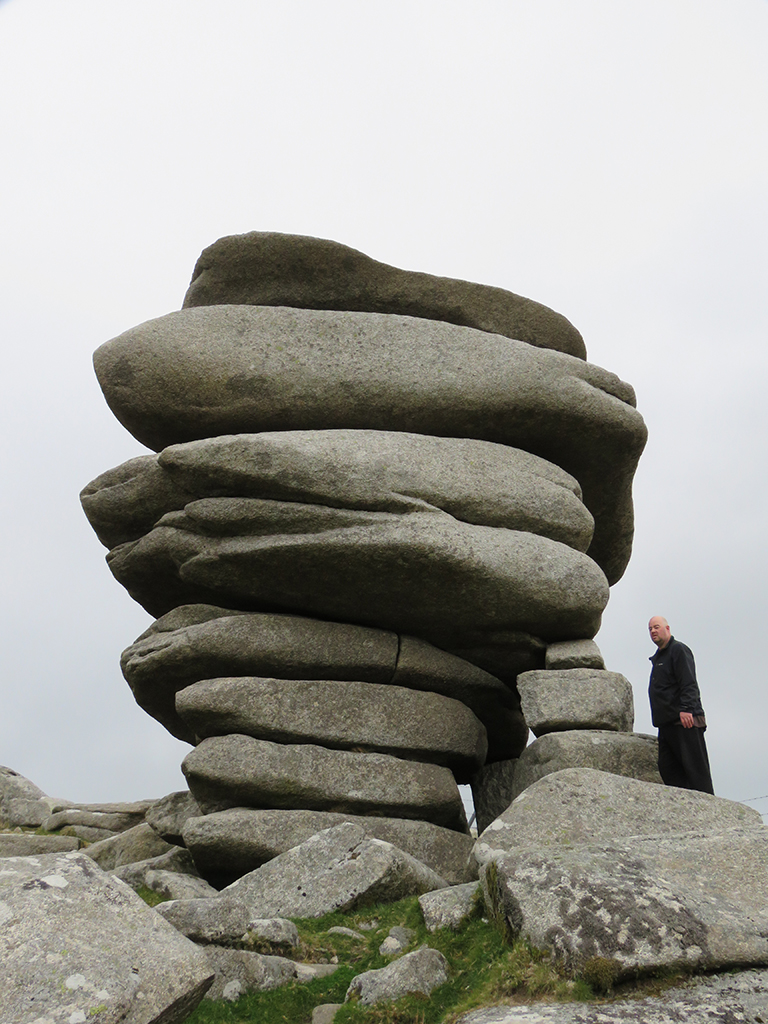 Granite outcrop with a person standing beside it.